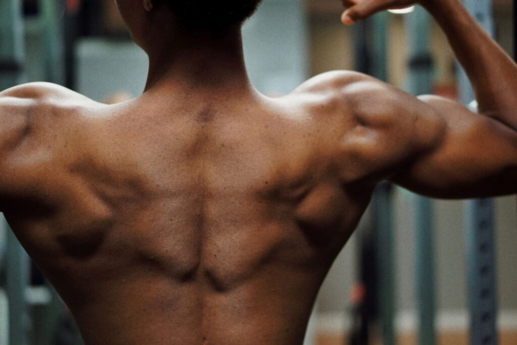 Man flexing his back muscles