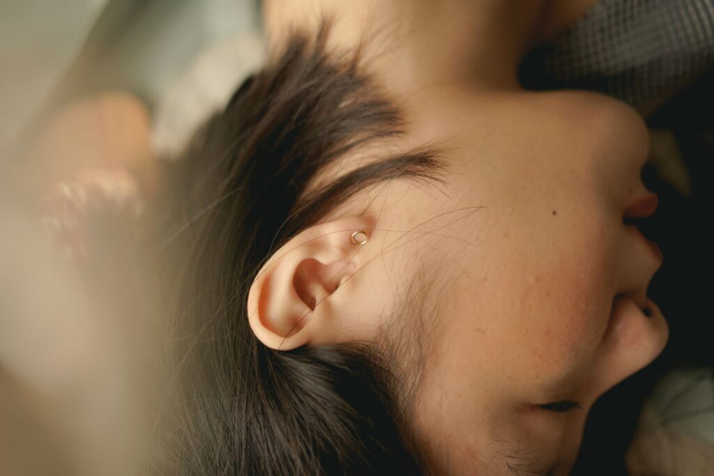 Close up of a woman's ear while she is sleeping